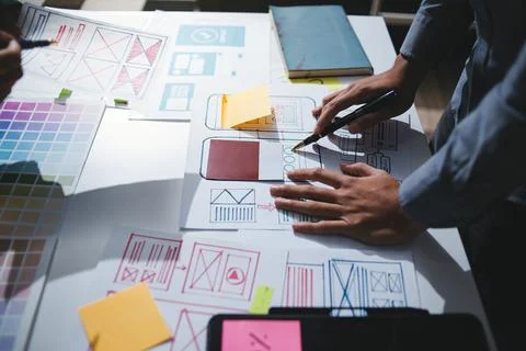 Team of UI UX web designer are working together to develop mobile responsiv.. Stock Photos