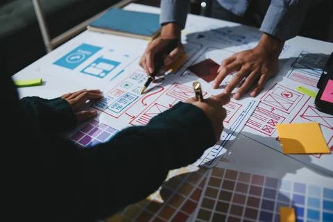 Team of UI UX web designer are working together to develop mobile responsiv.. Stock Photos