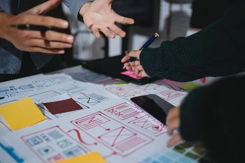 Team of UI UX web designer are working together to develop mobile responsiv.. Stock Photos