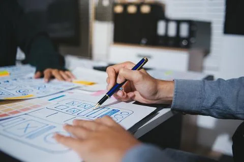 Team of UI UX web designer are working together to develop mobile responsiv.. Stock Photos