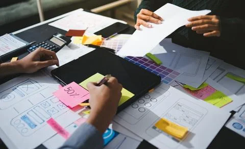 Team of UI UX web designer are working together to develop mobile responsiv.. Stock Photos