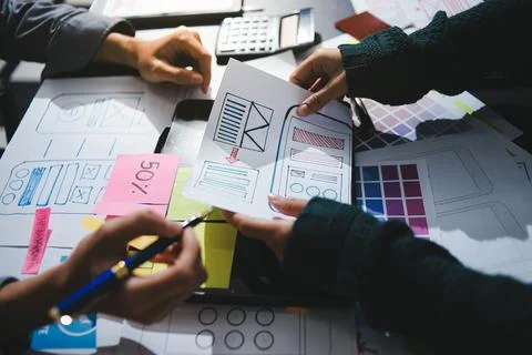 Team of UI UX web designer are working together to develop mobile responsiv.. Stock Photos