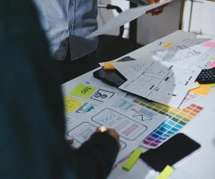 Team of UI UX web designer are working together to develop mobile responsiv.. Stock Photos