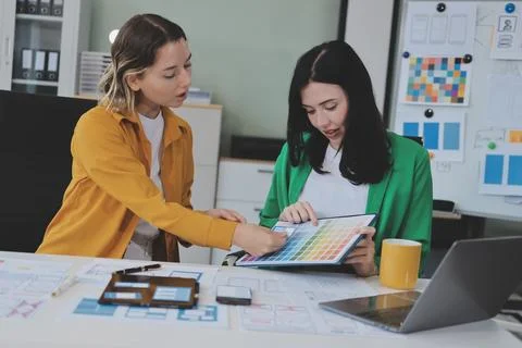 Team of UI UX web designer are working together to develop mobile responsiv.. Stock Photos