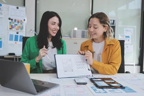 Team of UI UX web designer are working together to develop mobile responsiv.. Stock Photos