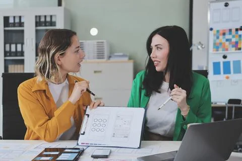 Team of UI UX web designer are working together to develop mobile responsiv.. Stock Photos