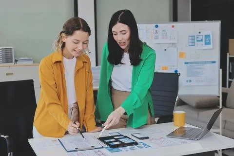 Team of UI UX web designer are working together to develop mobile responsiv.. Stock Photos