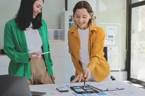 Team of UI UX web designer are working together to develop mobile responsiv.. Stock Photos