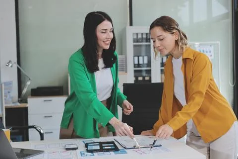 Team of UI UX web designer are working together to develop mobile responsiv.. Stock Photos