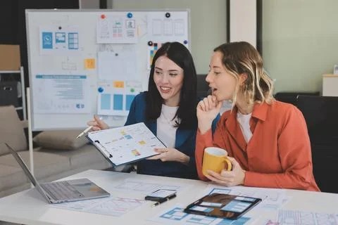 Team of UI UX web designer are working together to develop mobile responsiv.. Stock Photos