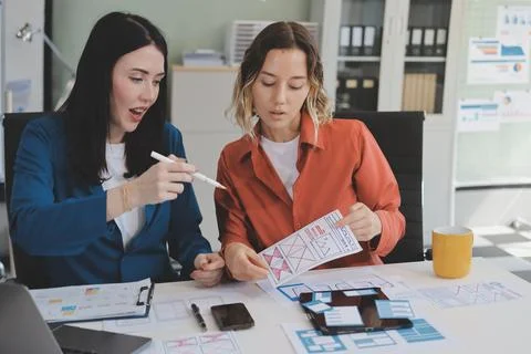 Team of UI UX web designer are working together to develop mobile responsiv.. Stock Photos