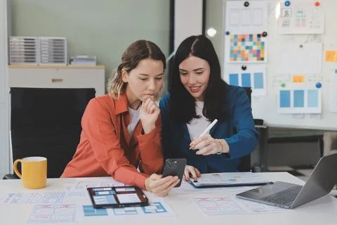 Team of UI UX web designer are working together to develop mobile responsiv.. Stock Photos