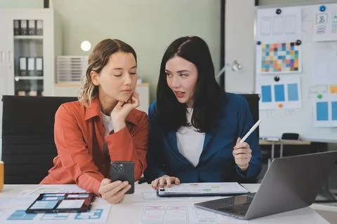 Team of UI UX web designer are working together to develop mobile responsiv.. Stock Photos