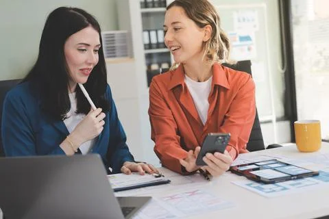 Team of UI UX web designer are working together to develop mobile responsiv.. Stock Photos