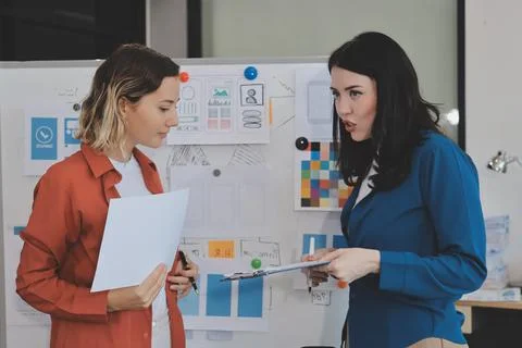 Team of UI UX web designer are working together to develop mobile responsiv.. Stock Photos