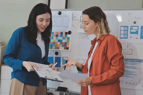 Team of UI UX web designer are working together to develop mobile responsiv.. Stock Photos