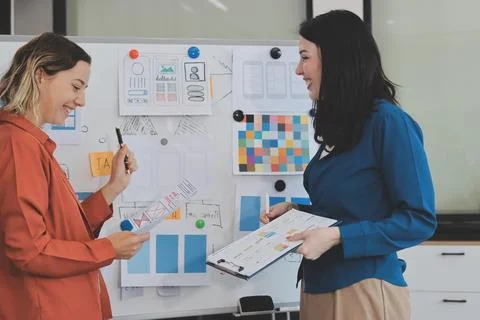 Team of UI UX web designer are working together to develop mobile responsiv.. Stock Photos