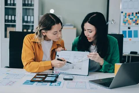 Team of UI UX web designer are working together to develop mobile responsiv.. Stock Photos