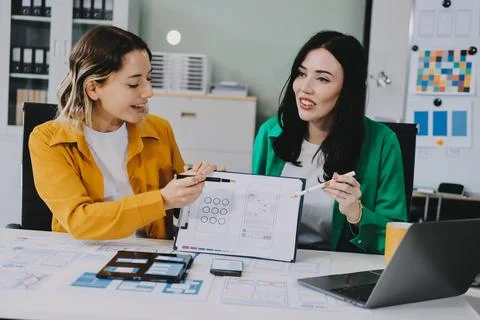 Team of UI UX web designer are working together to develop mobile responsiv.. Stock Photos
