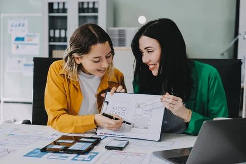 Team of UI UX web designer are working together to develop mobile responsiv.. Stock Photos