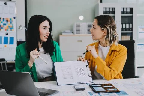 Team of UI UX web designer are working together to develop mobile responsiv.. Stock Photos