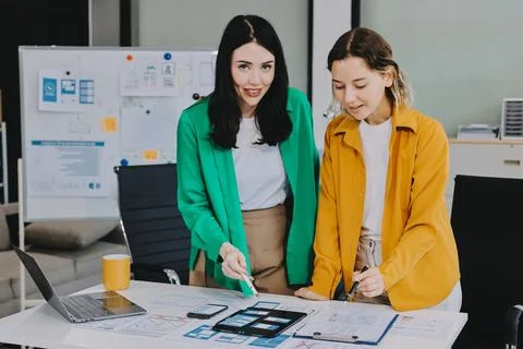 Team of UI UX web designer are working together to develop mobile responsiv.. Stock Photos