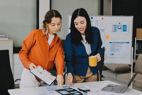 Team of UI UX web designer are working together to develop mobile responsiv.. Stock Photos