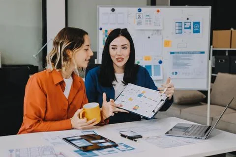 Team of UI UX web designer are working together to develop mobile responsiv.. Stock Photos