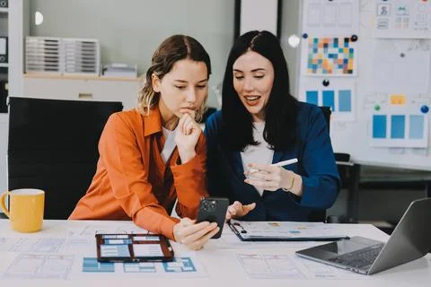 Team of UI UX web designer are working together to develop mobile responsiv.. Stock Photos