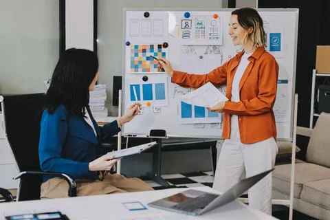 Team of UI UX web designer are working together to develop mobile responsiv.. Stock Photos