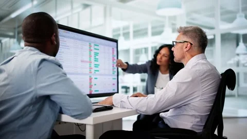 Team Using Multiple Computer Screens Stock Footage 312122524