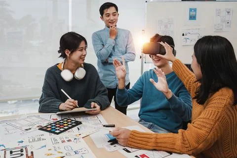 Team of ux developer and ui designer brainstorming interface wireframe design Stock Photos