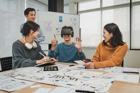 Team of ux developer and ui designer brainstorming interface wireframe design Stock Photos