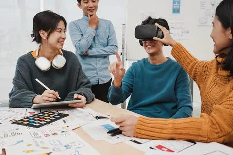 Team of ux developer and ui designer brainstorming interface wireframe design Stock Photos