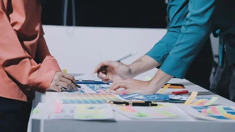 Team of uxui designers pointing at computer screen, discussing new mobile a.. Stock Footage 330325641
