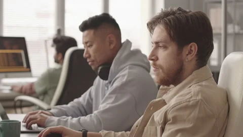 Team of Video Game Developers Working in Office Video stock 172192323