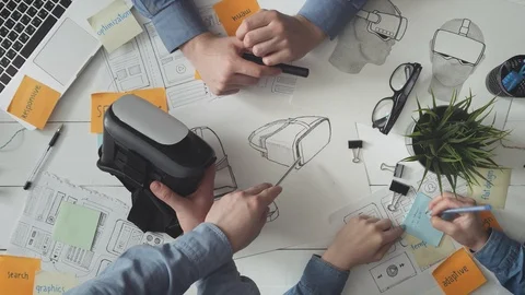 Team of VR developers working on a new headset Video stock 93889821