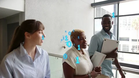 Team walking in atrium while discussing, AR overlay appearing above heads Stock Footage 334337926