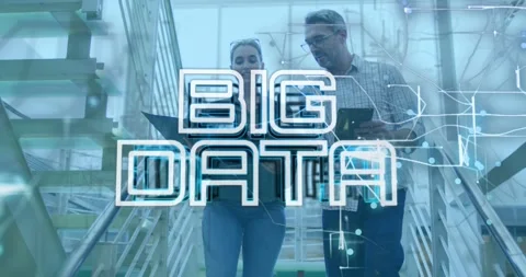 Team walking down stairs working on tablet and laptop, forming BIG DATA overlay Stock Footage 331429606