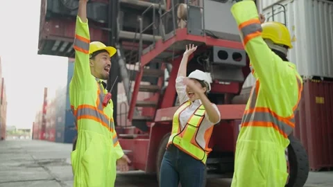 Team of warehouse industrial workers stack hands or join hand teamwork together. Stock Footage 262301334