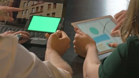 Team of web designers discussing while using digital devices. Stock Footage 80472249