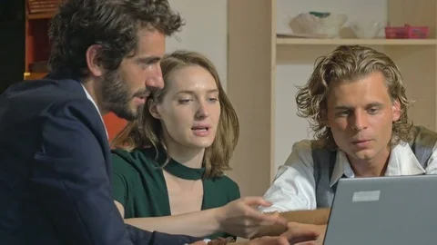 Team of web designers discussing while using digital devices. Stock Footage 80472309