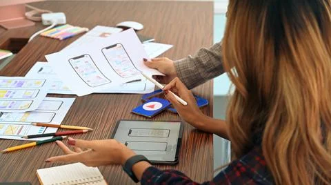 Team of web developer planning application and developing template layout Stock Photos