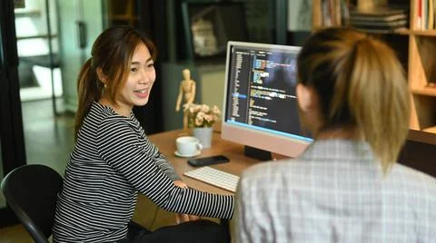 Team of website developer, software engineer working on a new project, writing Stockfoto's