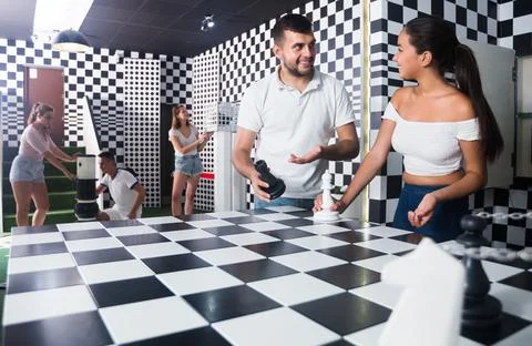 Team which divided into groups are trying to get out of the escape room Фото