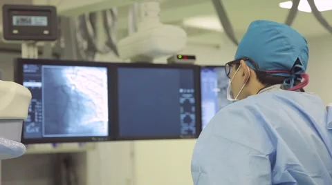 Team work with doctors, nurses, surgeons performing surgery on sick patient in Stock Footage 57513758