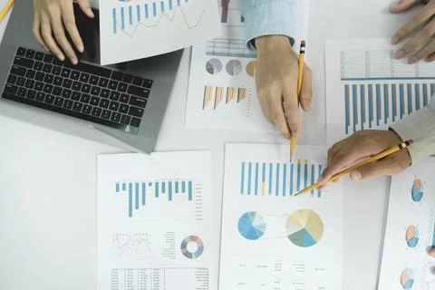 Team work process. Young business managers crew working with new startup pr.. Stock Photos