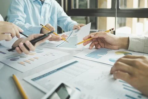 Team work process. Young business managers crew working with new startup pr.. Stock Photos