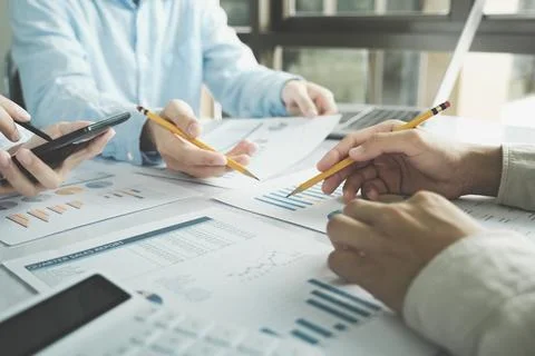 Team work process. Young business managers crew working with new startup pr.. Stock Photos