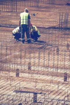 Team work on reinforcement metal framework Stock Photos